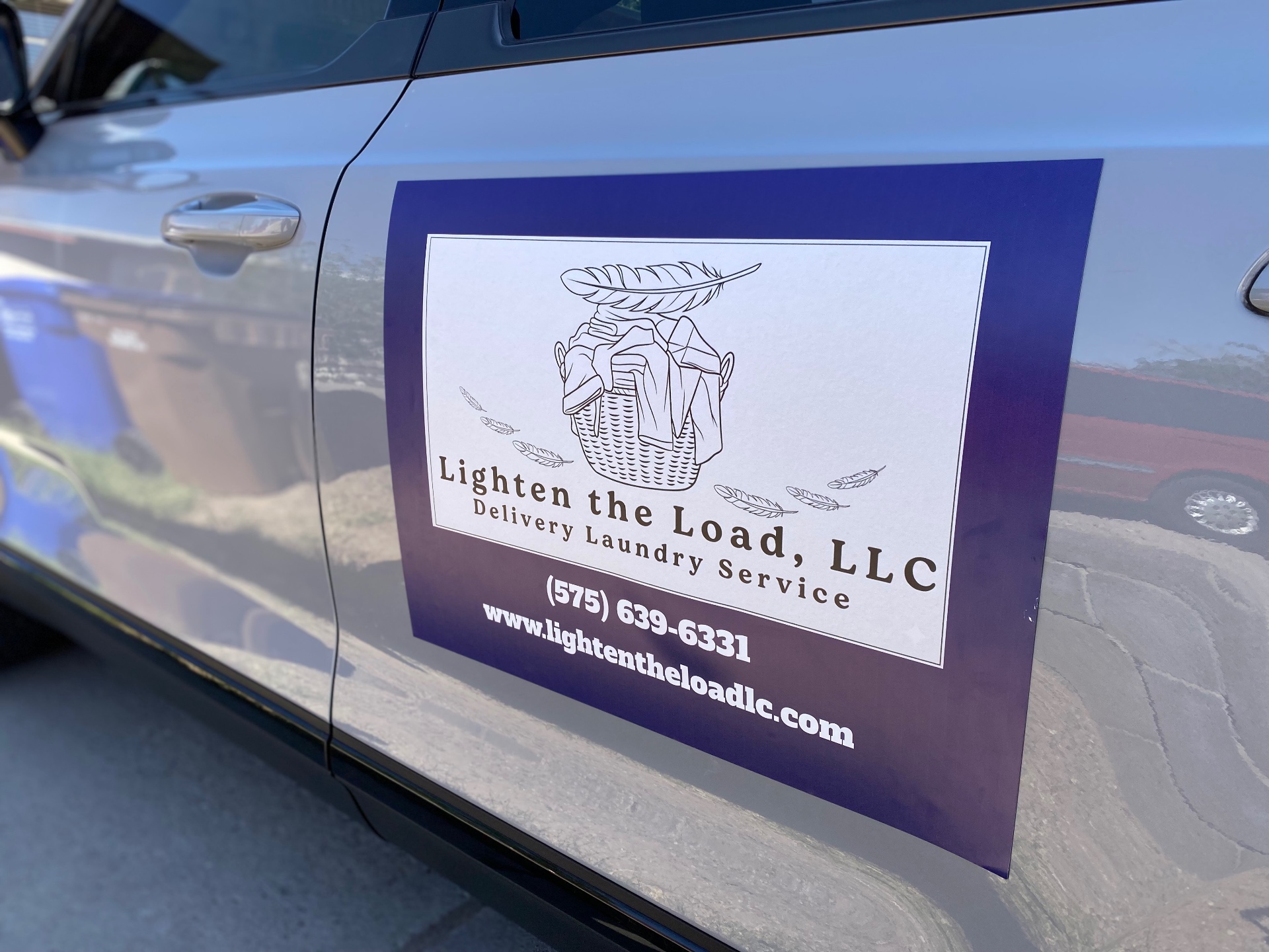 Lighten the Load, LLC delivery vehicle magnet — (575) 639-6331, www.lightentheloadllc.com